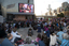 Crowds watching the screen in Federation Square