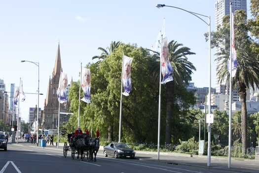 Carols by Candlelight flags along St Kilda Road