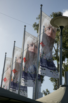 Carols flags flying above the Myer Music Bowl
