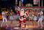 Santa and Hi-Five performing on the stage