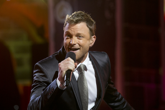 Tim Campbell performing on the stage