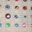 Anodised aluminum lids forming a wall sculpture