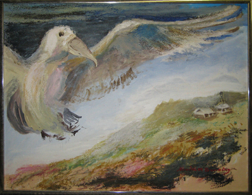 A bird flies above a coastlline
