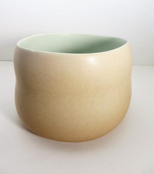 Brown ceramic vessel with green interior