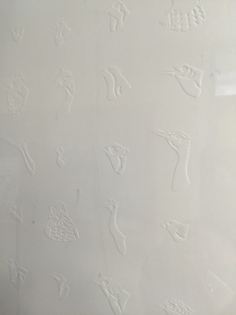 embossed birds on the white paper