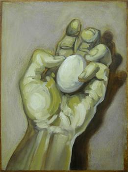 A hand holding an egg