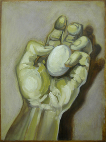 A hand holding an egg