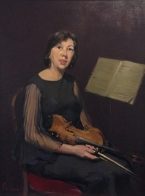 A woman holding a violin