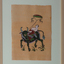 Man reclining on a bull flying a kite