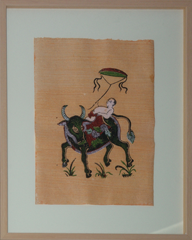 Man reclining on a bull flying a kite