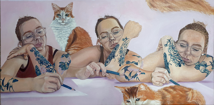 A tatooed woman drawing while surrounded by cats