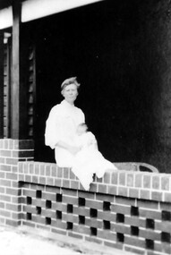 Photograph, Midwife with one of the Palstra children, c 1921, 1921