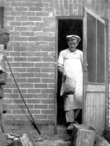 Photograph, Donald Hartley Rowe at his bakery at 118 Union Road, Surrey Hills