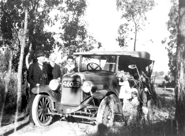 Photograph, Cerini family and their "Overland" car on an outing, c 1927, 1927