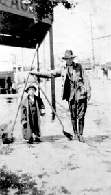 Photograph, Fred Lyons and his son Arthur after a hail storm, 1924, 1924