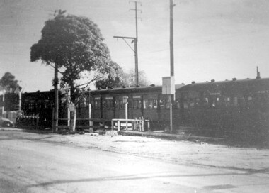 Photograph - Black and White Photograph, Last train to cross the grade level crossing at Elgar Road