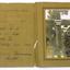 Brown paper folder with photograph of soldier's grave inside.