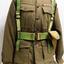 A heavy cloth jacket with metal and cloth badges. 