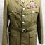 Soldiers uniform with silver buttons and badges.