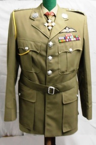 Soldiers uniform with silver buttons and badges.