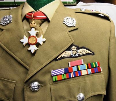 Soldier's uniform showing badges and medal ribbons.