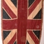 Large flag with fringe around edge.
