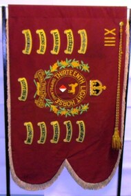 Flag with swallow tail and tags around edges.