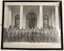 Large group of soldiers on steps of grand building.
