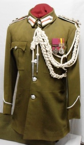 soldier's jacket with medals and decorative cords
