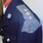 Chain mail on shoulder of jacket.