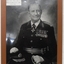 Framed photograph of officer wearing the uniform and medals.