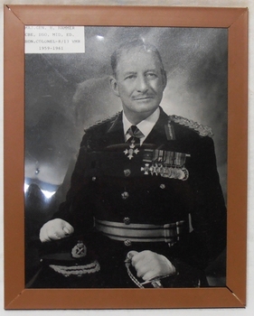 Framed photograph of officer wearing the uniform and medals.