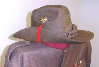 Soldiers jacket and hat with buttons and badges