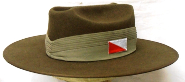Large hat with coloured patch on side.