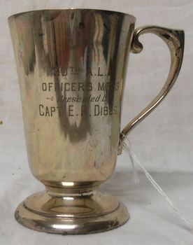 Metal drinking mug with handle.