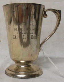 Metal drinking mug with handle.