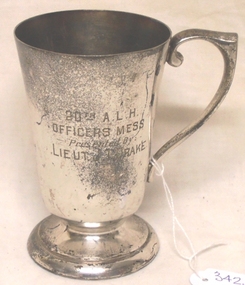 Metal drinking cup with inscription on side
