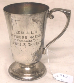 Metal drinking cup with inscription on side