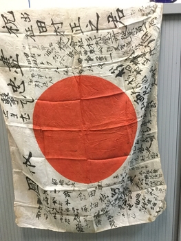 White red and white flag with writing on it.