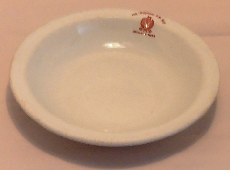 Soup bowl with monogram on edge.