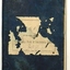 Black covered book with tattered label.