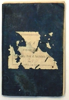 Black covered book with tattered label.