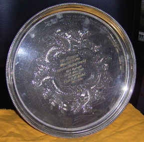 Silver serving tray engraved at centre