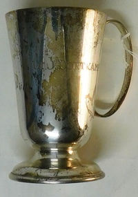 Metal drinking mug with inscription on side