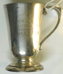 Metal drinking cup with inscription on side