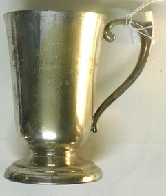 Metal drinking cup with engraving on side