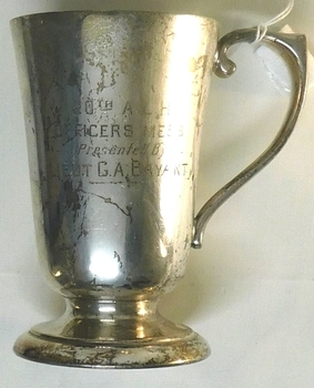 Metal drinking cup with inscription on side