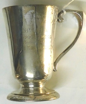 Metal drinking cup with inscription on side