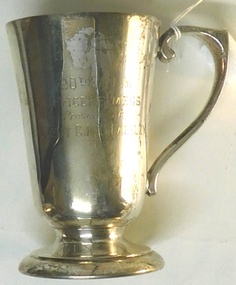 Metal drinking cup with inscription on side
