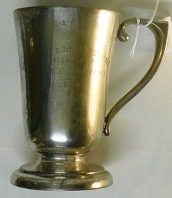 Metal drinking cup with handle and engraving